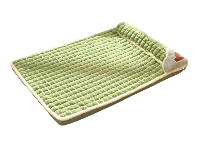 A light green quilted dog mat with a raised pillow edge
