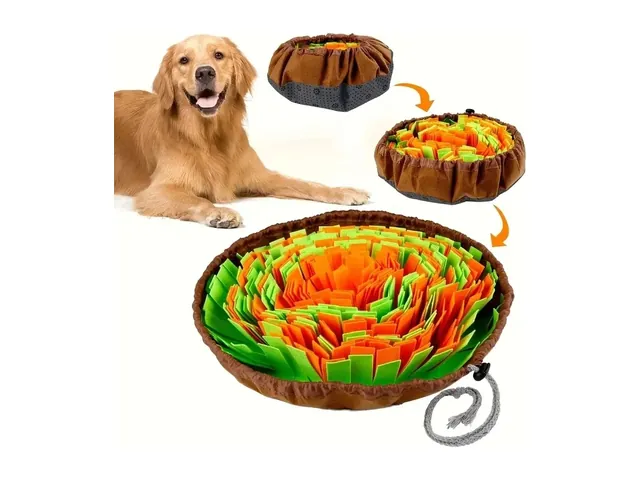 A golden retriever lying next to a round felt snuffle mat in green, orange and brown