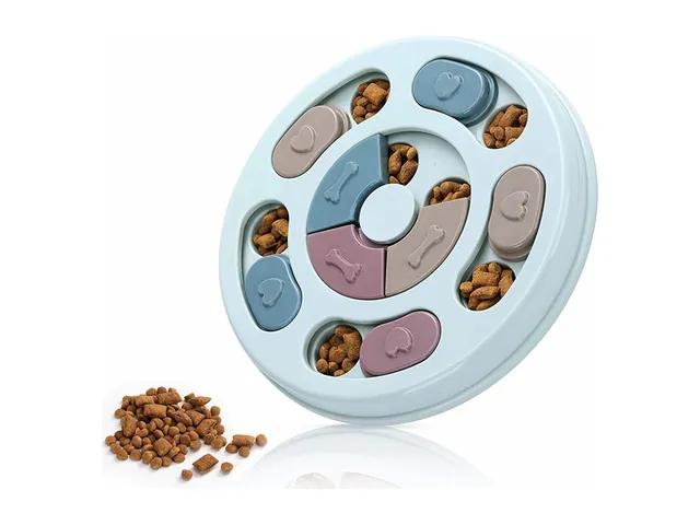 A round light blue puzzle feeder bowl with kibble in its compartments